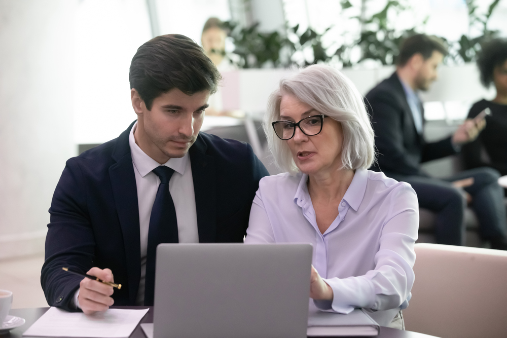 Female go-to expert teaching associate on laptop