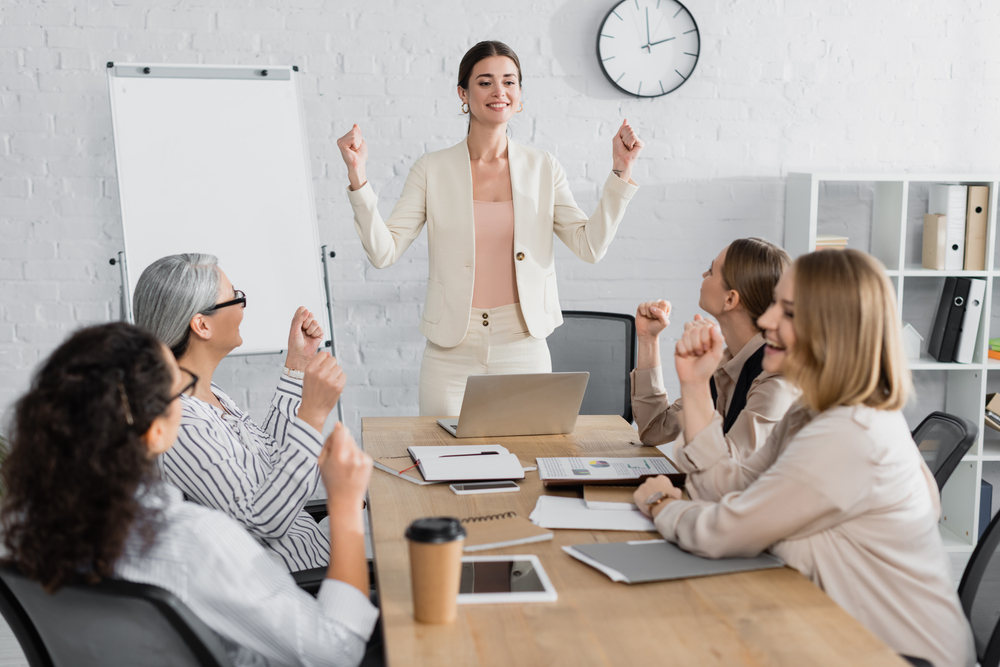 Leader talking to coworkers about how to turn challenges into opportunities