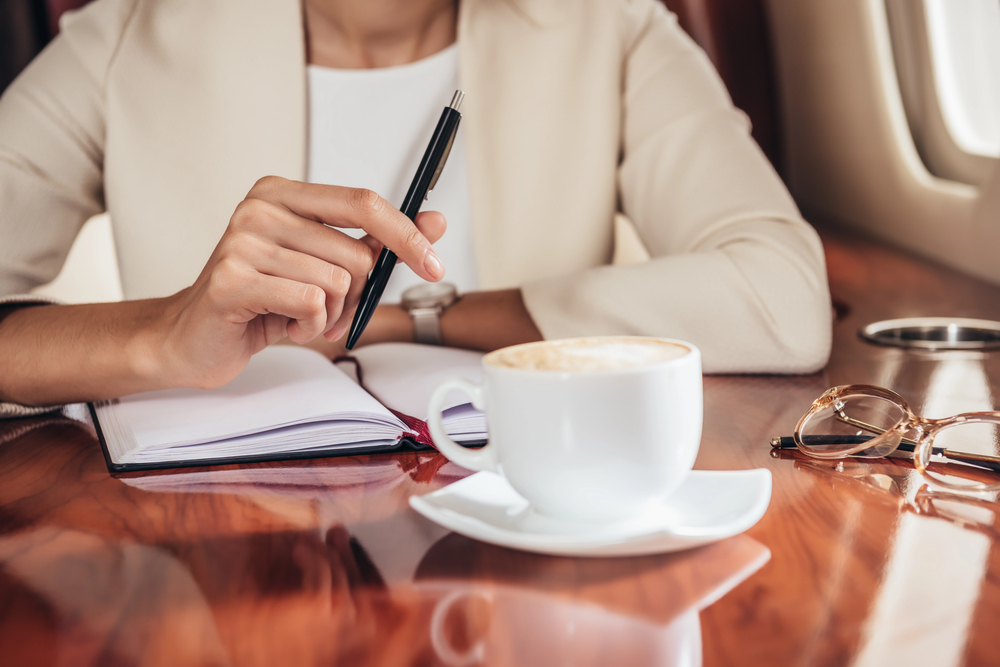 professional woman holding a pen to write linkedin content