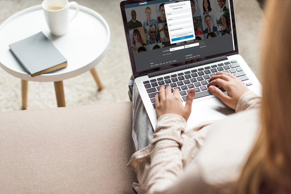 Woman working on LinkedIn content on her laptop